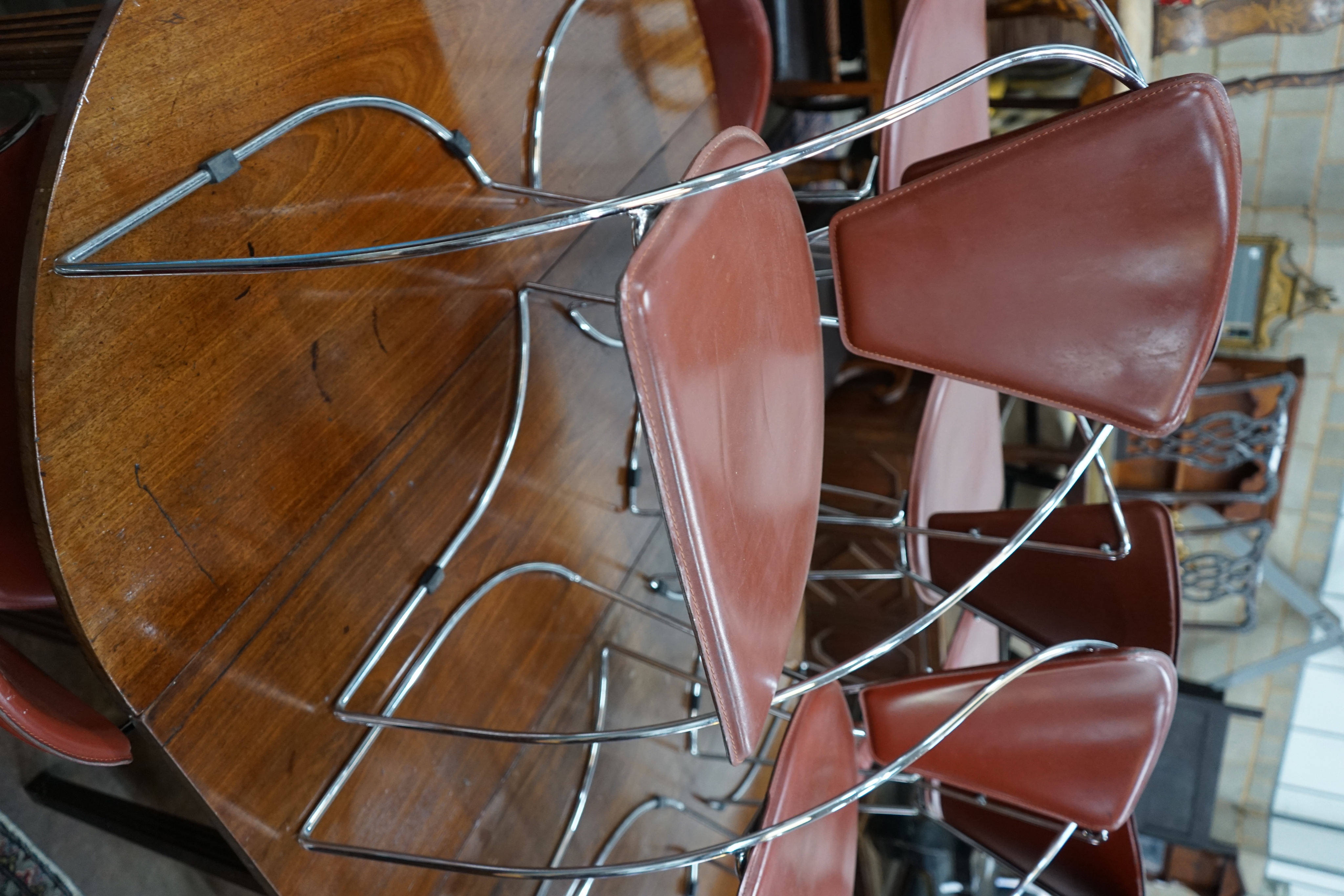 A set of eight contemporary Italian leather and chrome dining chairs, width 52cm depth 55cm height 78cm